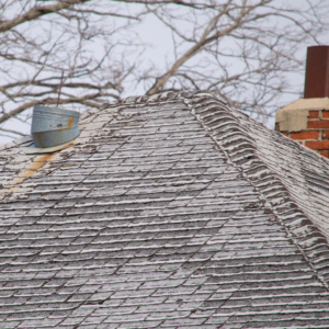 Grey shingles deteriorating from excessive aging and outdoor elements